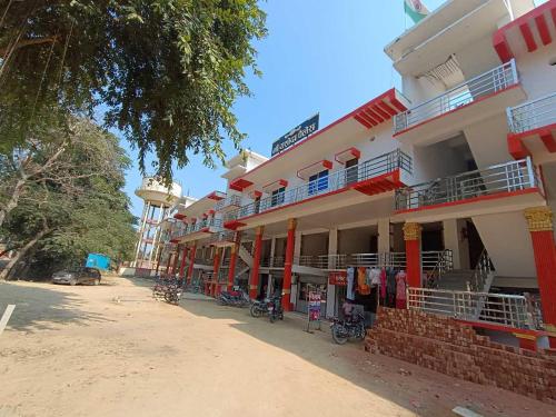 a building with bikes parked in front of it at Hotel O Maa Yashodha Palace in Ayodhya