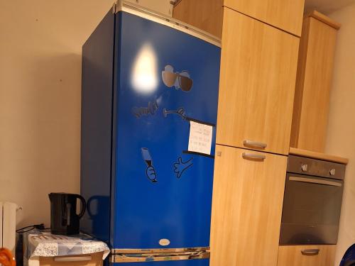 a blue refrigerator with the words chill on it at Michelle Apartment in Bari