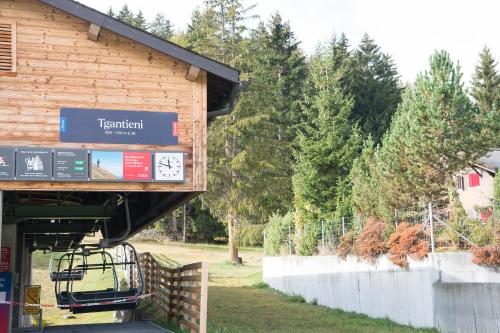 a train station with a sign that says train station at Ferienhaus Tgantieni Ski-in Ski-out-Lenzerheide in Lenzerheide