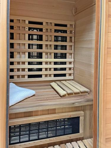 a sauna with a bench in the middle at Ferienhaus Tgantieni Ski-in Ski-out-Lenzerheide in Lenzerheide