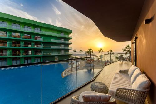 a view of a swimming pool from a hotel room at voco Dubai Monaco, the Heart of Europe by IHG in Dubai