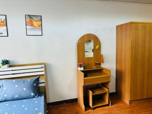 a bedroom with a dressing table and a mirror at Condo Poppular T8 fl.7 in Thung Si Kan