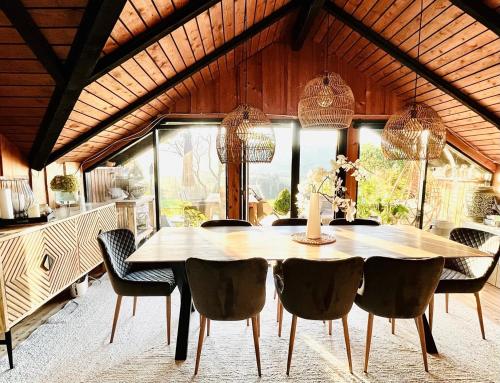 a dining room with a table and chairs at Chalet - Kleines Paradies - in Appenzell