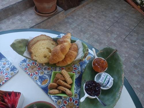 a plate of food on a table with food at B&B Ninni in Castelbuono