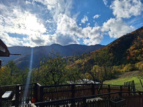 a view of the mountains from the porch of a house at Chata Vlkolínec in Ružomberok