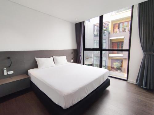 Cama ou camas em um quarto em Hazuki Apartment 504