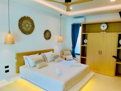 a bedroom with a large white bed in a room at Yuka residence in Koh Samui 