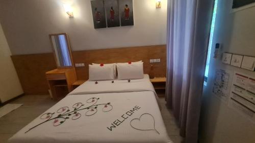 Postel nebo postele na pokoji v ubytování Hitha Maldives - Omadhoo