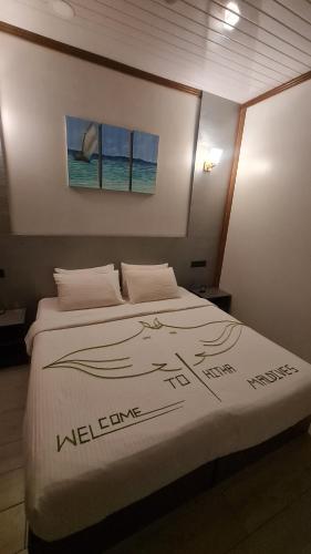 Postel nebo postele na pokoji v ubytování Hitha Maldives - Omadhoo