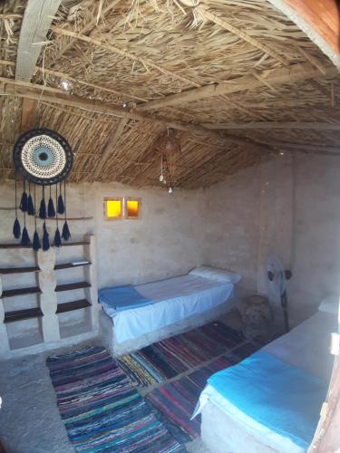 Una cama o camas en una habitación de M Biama Island