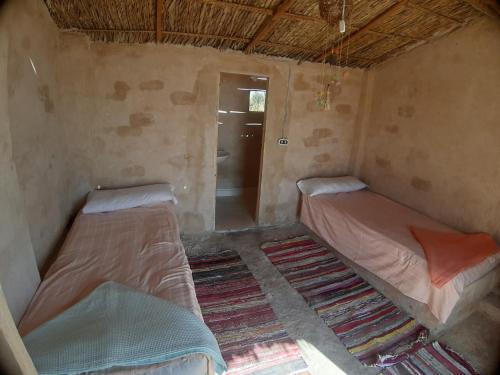 Una cama o camas en una habitación de M Biama Island