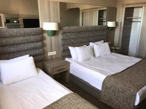 Krevet ili kreveti u jedinici u okviru objekta Grand Yazici Ski Hotel & Spa