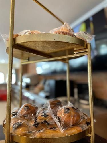 a tray of donuts in plastic bags on a table at Hotel Sol Sanlúcar in Sanlúcar la Mayor