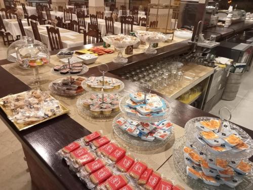 a buffet with many plates of food on a table at Hotel Sol Sanlúcar in Sanlúcar la Mayor