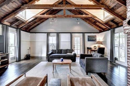a living room with a couch and a table at Modern Farm house in heart of the City- Sleeps 12 in Atlanta