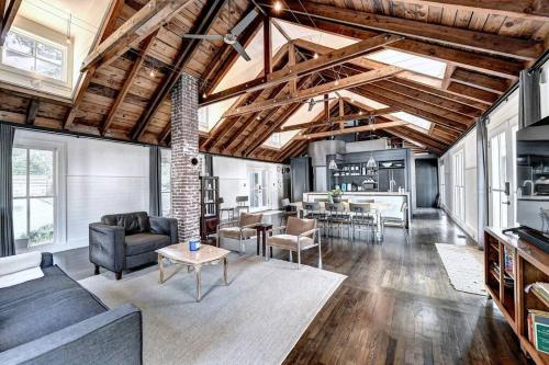 a living room with a couch and a table at Modern Farm house in heart of the City- Sleeps 12 in Atlanta