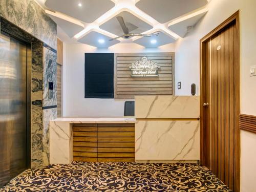 a kitchen with a large marble counter and a ceiling at THE SUPERB HOTEL PVT LTD in Hyderabad