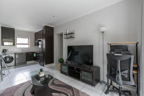 Televízia a/alebo spoločenská miestnosť v ubytovaní K Luxe Apartment