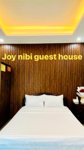 Postel nebo postele na pokoji v ubytování Joy Nibi Guest House