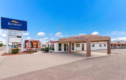 a building with a sign for a bmw dealership at Baymont by Wyndham Socorro in Socorro