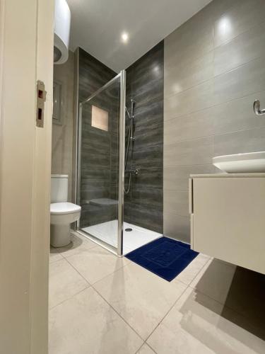a bathroom with a shower and a toilet and a sink at Rent a Home Hurghada in Hurghada