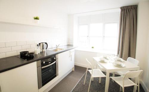 Køkken eller tekøkken på Fox Street Apartments