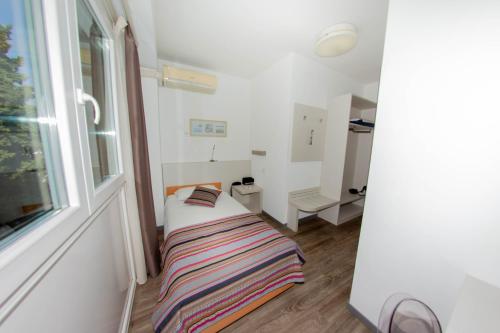 Postel nebo postele na pokoji v ubytování Colorado Hotel