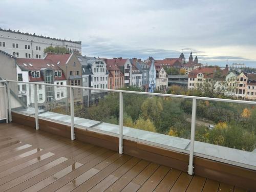 a balcony with a view of a city at Apartament Stary Szczecin in Szczecin