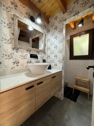 a bathroom with a sink and a mirror at Casa Silente in San Carlos de Bariloche