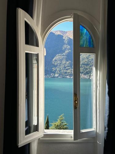 an open window with a view of the water at Briisa De Ness in Nesso