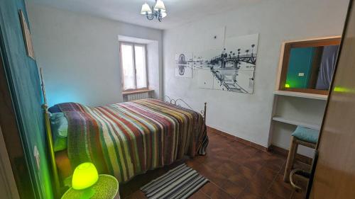 a small bedroom with a bed and a window at Casa Vacanza San Piero in San Piero in Campo
