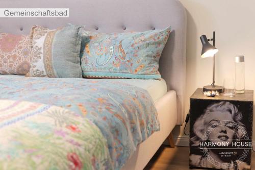 a bedroom with a bed with a blue comforter and a lamp at Harmony House in Handewitt