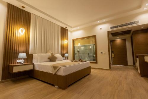 a bedroom with a large bed in a room at Ramage Hotel & Resort in Cairo