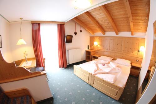 מיטה או מיטות בחדר ב-Hotel Val