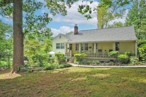 a yellow house with a porch and a tree at House Near Bju, Furman, & Town in Greenville