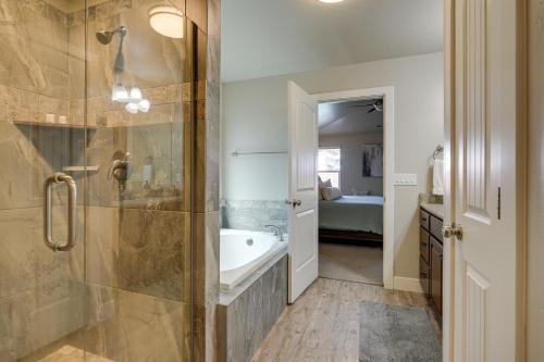 a bathroom with a shower and a bath tub at Hurricane Getaway with Private Pool, Mtn Views! in Hurricane