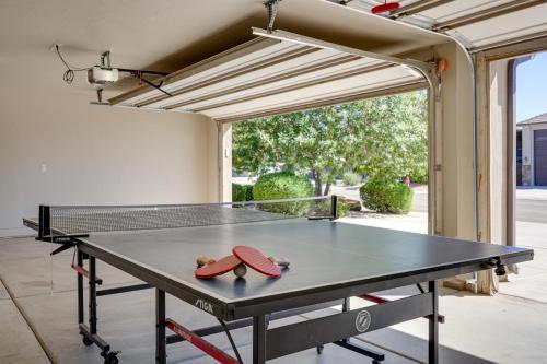 a ping pong table in the middle of a patio at Hurricane Getaway with Private Pool, Mtn Views! in Hurricane