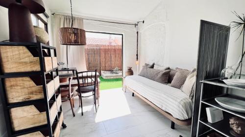 a living room with a couch and a table at Casa Boutique Luxury Yumbo in Playa del Ingles