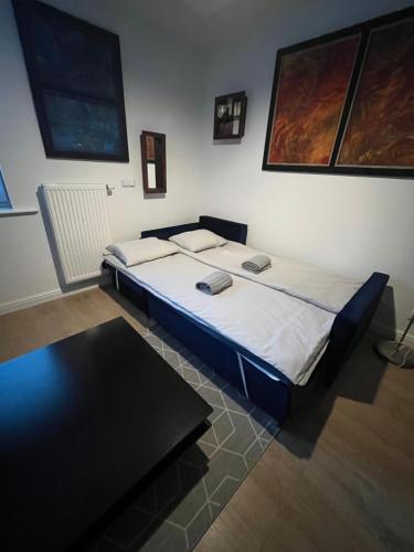 a bedroom with a bed in a room at U Filipa in Gdynia