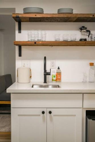 a kitchen with a sink and a counter top at The Alberta Escape in Portland