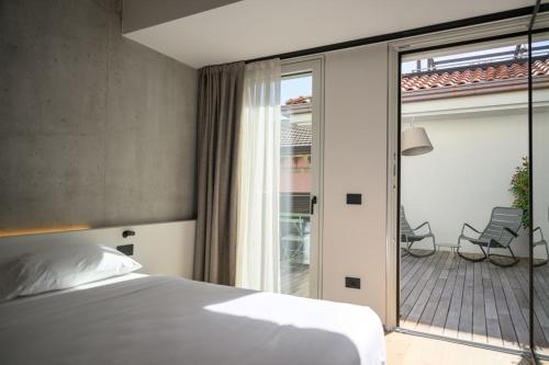 Ένα ή περισσότερα κρεβάτια σε δωμάτιο στο Hotel Giardino Verdi