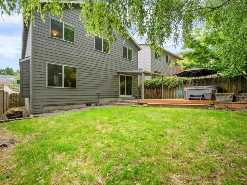 a house with a backyard with a grill at Troutdale Treasure - Spacious 3BR, 3 Bath Home near Edgefield in Troutdale