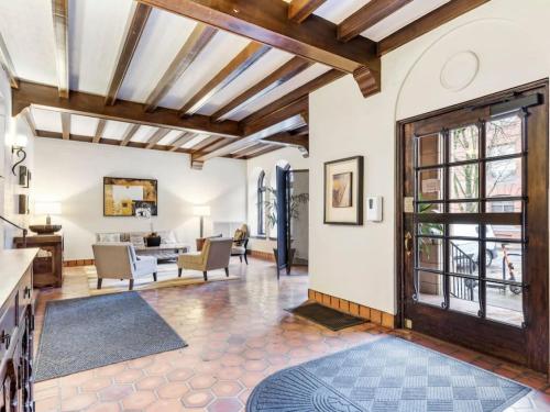 an open living room with a wooden ceiling at Central Downtown Studio with Vintage Charm near Train in Portland