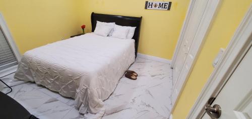 a bedroom with a bed with a marble floor at tom house in Tampa