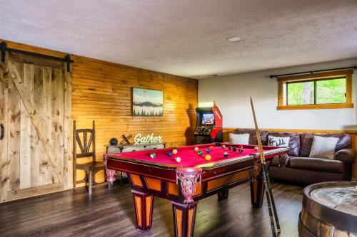 a room with a pool table in the middle of a room at Woodhaven - Private - 3 Suites - Gorgeous Views - 3 Pools - GameRm - HotTub - Lots of Bears in Gatlinburg