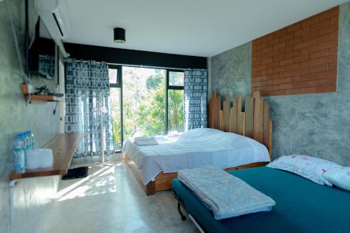 Postel nebo postele na pokoji v ubytování Ob-Oon Khao Kho Resort
