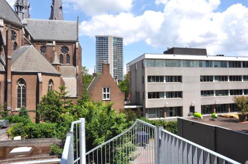 a view of an old city with a building at De Eindhovenaar City Apartments in Eindhoven