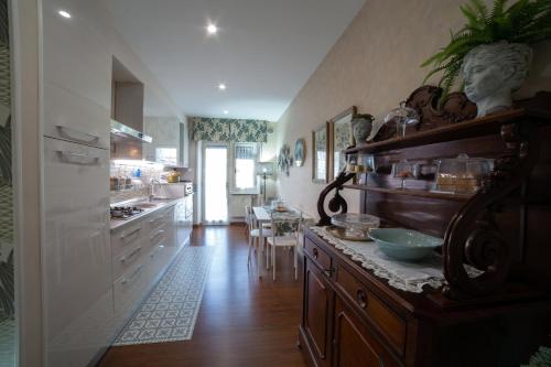 a kitchen with a counter and a dining room at Dimora Giulia in Campobasso