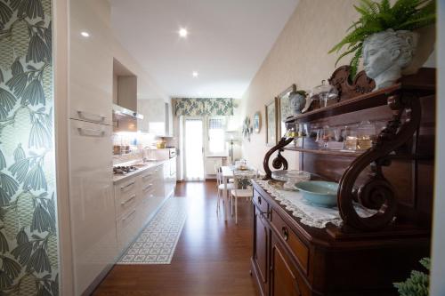 a kitchen with a counter with a sink in it at Dimora Giulia in Campobasso