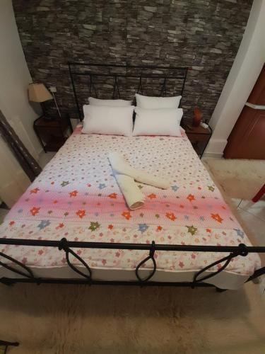 a bed with two utensils on top of it at Villa of byron in Kastrákion